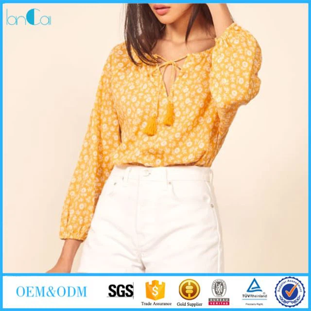 Women Yellow Printed Tops And Blouses